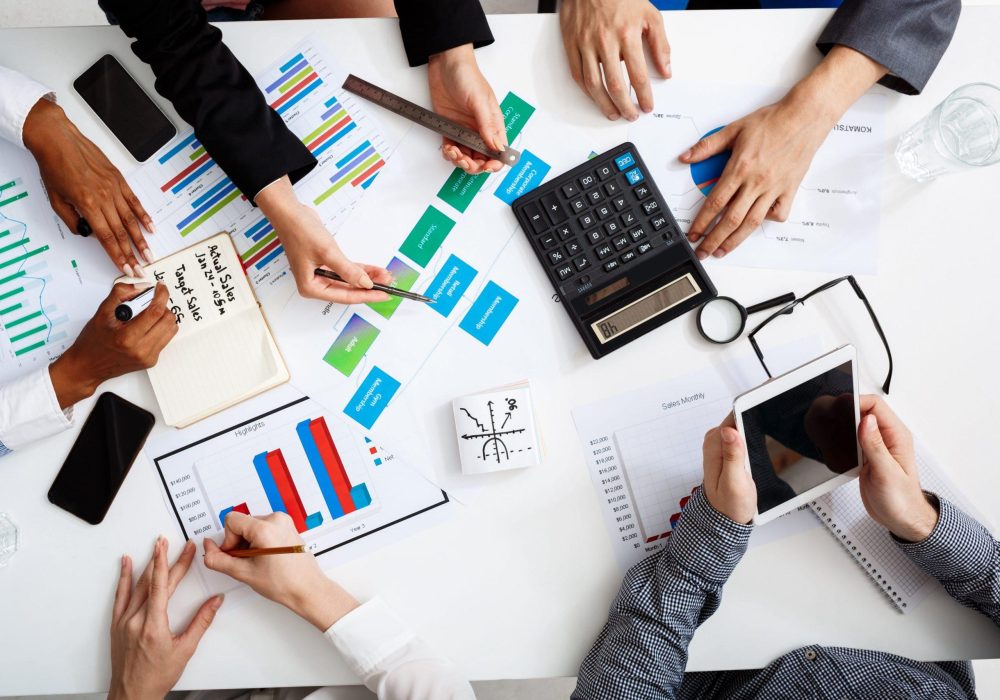 businessmen-hands-white-table-with-documents-drafts (1)